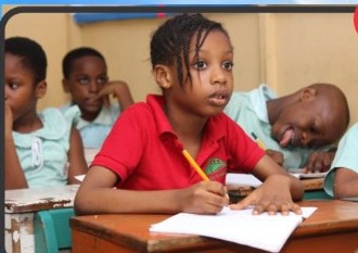 Child reading the Children's Writing Companion in class